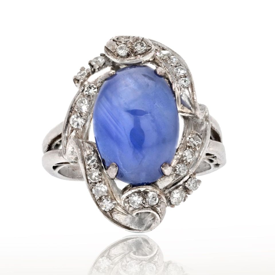 Art Deco 14K White Gold Star Sapphire Diamond Estate Ring: Art Deco 14K White Gold Star Sapphire Diamond Estate Ring This exquisite Art Deco ring features a captivating star sapphire, beautifully set in lustrous 14K white gold. The ring, weighing 5.3 grams, i