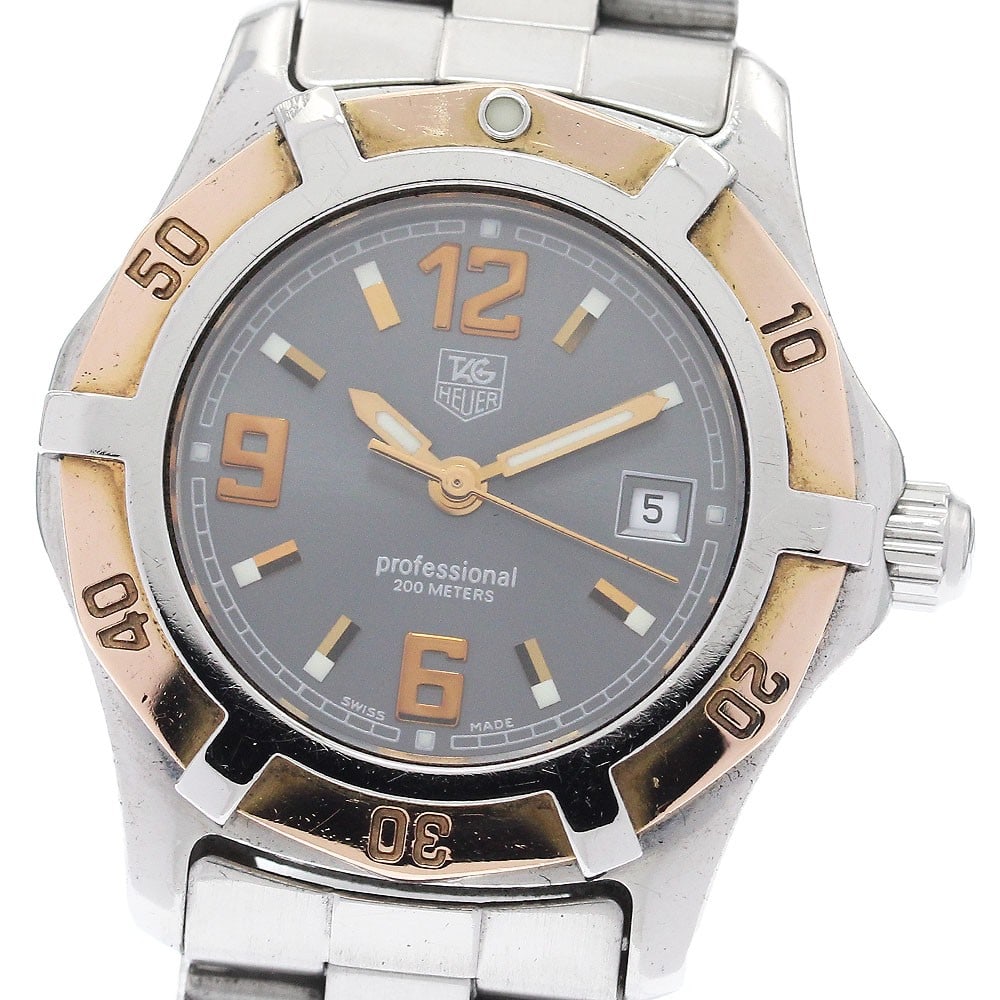 TAG Heuer Exclusive women's quartz date wristwatch WN1351: TAG Heuer Exclusive women's quartz date wristwatch WN1351 This TAG HEUER Exclusive Date Quartz women's wristwatch features a stainless steel and gold-plated case with a matching stainless steel bracel