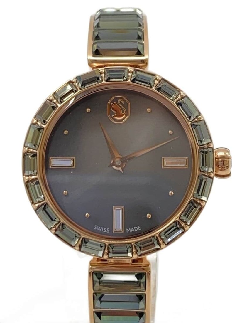 Swarovski Gold Tone Stainless Steel Women's Quartz Wristwatch: Swarovski Gold Tone Stainless Steel Women's Quartz Wristwatch This SWAROVSKI women's wristwatch features a gold tone stainless steel construction and a quartz movement. Made in Switzerland, the watch 