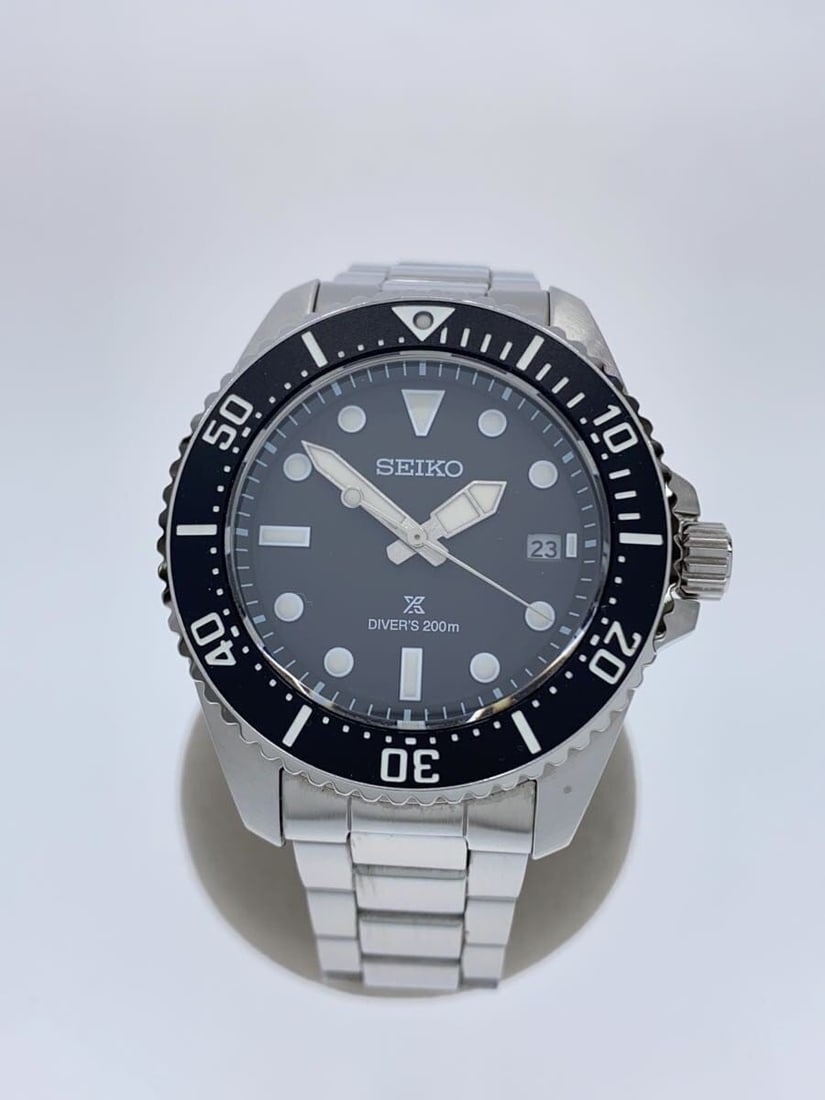 Seiko Prospex black stainless steel diver wristwatch V157-00A0: Seiko Prospex black stainless steel diver wristwatch V157-00A0 This SEIKO Prospex Diver Scuba V157-00A0 men's wristwatch features a stainless steel case and band with a black dial. Made in Japan, it i