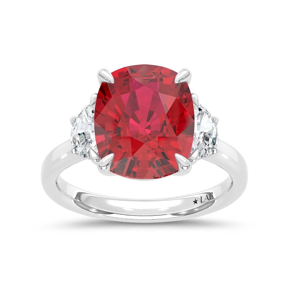 14K White Gold Lab Grown Diamond 6 Ct.Tw. Cushion Shape Recrystalized Ruby Engagement Ring (Center 5: 14K White Gold Lab Grown Diamond 6 Ct.Tw. Cushion Shape Recrystalized Ruby Engagement Ring (Center 5 1/2 ct) Exude sophistication with this 14K white gold engagement ring, featuring a magnificent 5 1/