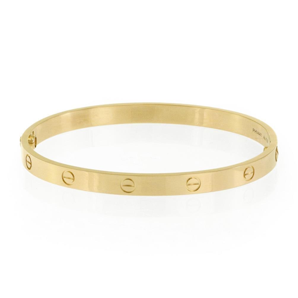 Cartier Love Classic 18k Yellow Gold Bangle Size 21 with Paper Screwdriver: Cartier Love Classic 18k Yellow Gold Bangle Size 21 with Paper Screwdriver Authentic Cartier LOVE Collection classic bangle crafted in 18k yellow gold with a high polished finish. This oval bracelet f