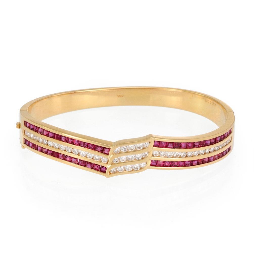 Estate 5.5ct Diamond Ruby 18k Yellow Gold Hinged Bracelet: Estate 5.5ct Diamond Ruby 18k Yellow Gold Hinged Bracelet This stunning Estate bracelet is expertly crafted from 18k yellow gold with a polished finish. It features a captivating centerpiece that is 1