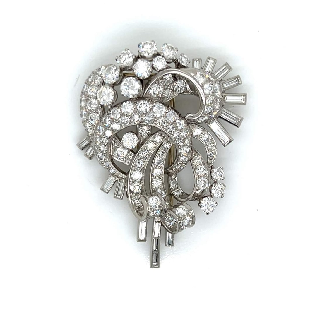 Art Deco Platinum Brooch 12.20 Ct Diamonds 104 European-Cut 16 Baguette: Art Deco Platinum Brooch 12.20 Ct Diamonds 104 European-Cut 16 Baguette This stunning Art Deco brooch is crafted from platinum and features a total diamond weight of 12.20 Ct. It is adorned with 104 E