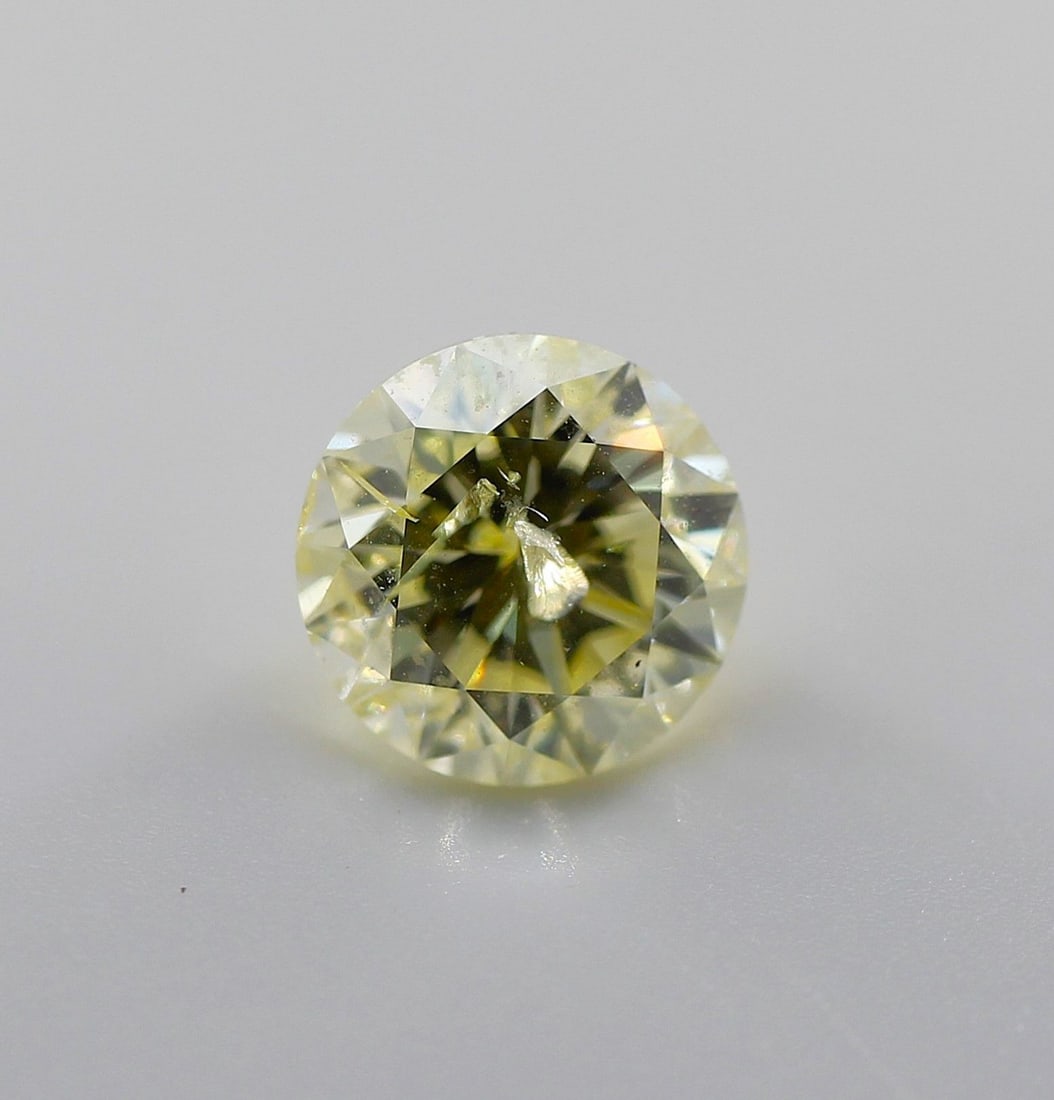 Loose Diamond - ROUND 1.56ct Fancy Light Yellow I2: Loose Diamond - ROUND 1.56ct Fancy Light Yellow I2 Source: Natural Shape: ROUND Carats: 1.56 Color: Fancy Light Yellow Certification: NONE PLEASE NOTE: Framed, Large, or heavy items do not have shippi