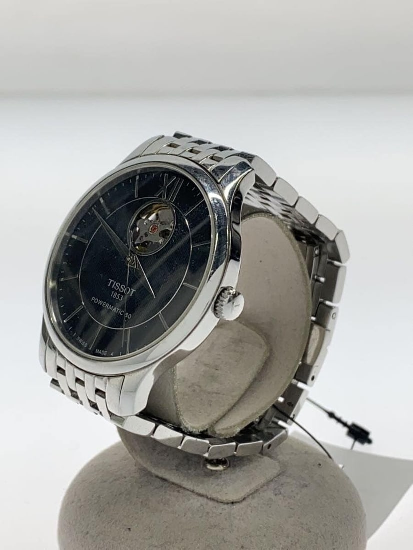 Tissot Tradition Open Heart Men's Stainless Steel Wristwatch: Tissot Tradition Open Heart Men's Stainless Steel Wristwatch This TISSOT Tradition Powermatic 80 Open Heart men's wristwatch features a black dial and a stainless steel case and band. Designed in Swit