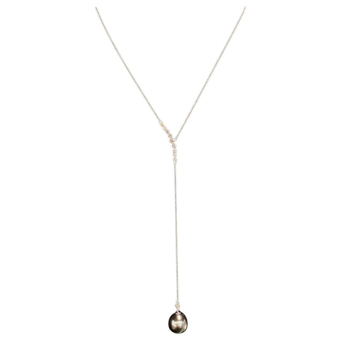 Harbor Diamonds 18K White Gold Tahitian Pearl Diamond Lariat Necklace 0.51 Carats: Harbor Diamonds 18K White Gold Tahitian Pearl Diamond Lariat Necklace 0.51 Carats This stunning lariat necklace is crafted from 18K white gold and showcases a contemporary design. It features a beauti