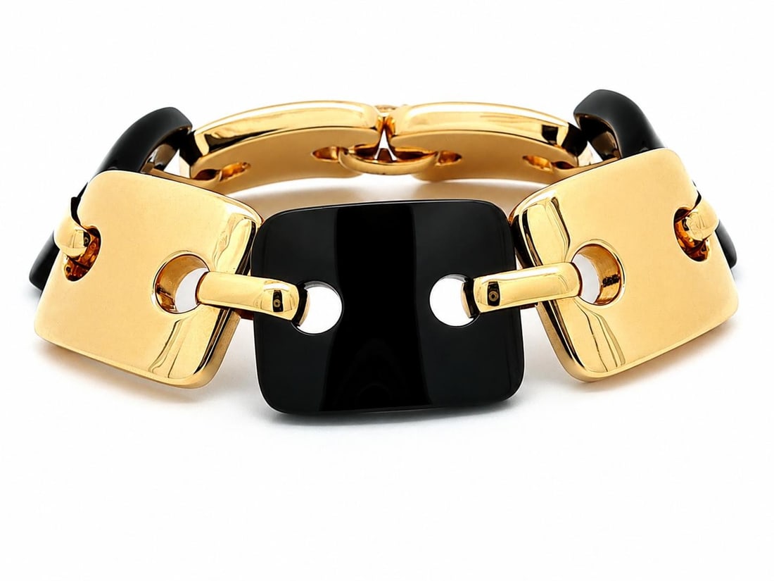 Unbranded 14k Yellow Gold Bracelet with Black Hardstone Rectangular Links: Unbranded 14k Yellow Gold Bracelet with Black Hardstone Rectangular Links Pre-owned women's chain bracelet crafted in solid 14k yellow gold with rectangular puffed links alternating with natural genui