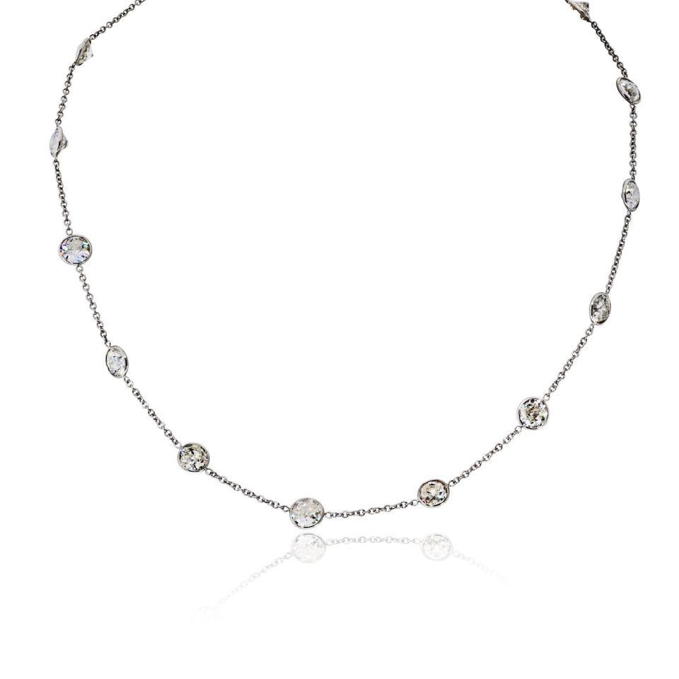 Platinum 16 Inch Necklace With 15 Old European Cut Diamonds 12.36cttw: Platinum 16 Inch Necklace With 15 Old European Cut Diamonds 12.36cttw This elegant necklace features 15 old European cut diamonds, totaling approximately 12.36 carats, each averaging 0.82 carats. Craf
