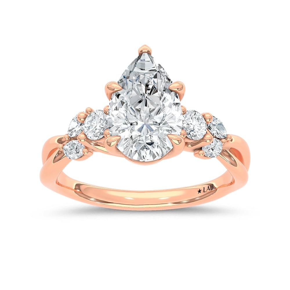 14K Rose Gold 2 1/3 Ct.Tw. Lab Grown Diamond Pear Shape Engagement Ring (IGI Certified Center 2ct: 14K Rose Gold 2 1/3 Ct.Tw. Lab Grown Diamond Pear Shape Engagement Ring (IGI Certified Center 2ct Pear) Celebrate your love with this elegant 14K Rose gold engagement ring, featuring a 2-carat IGI-cer