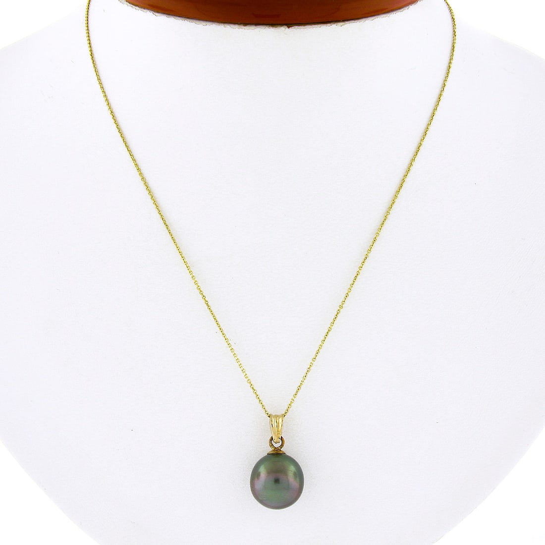 14K Yellow Gold 11.5mm Tahitian Gray Pearl Pendant Necklace: 14K Yellow Gold 11.5mm Tahitian Gray Pearl Pendant Necklace This exquisite necklace features a stunning 11.5mm Tahitian gray pearl solitaire pendant, elegantly crafted from solid 14K yellow gold. The 