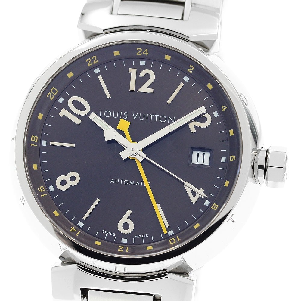 Louis Vuitton Tambour Q1131 mens GMT date wristwatch: Louis Vuitton Tambour Q1131 mens GMT date wristwatch Louis Vuitton Tambour GMT Date men's wristwatch, reference Q1131, with a Swiss origin and automatic movement. It features a stainless steel case an
