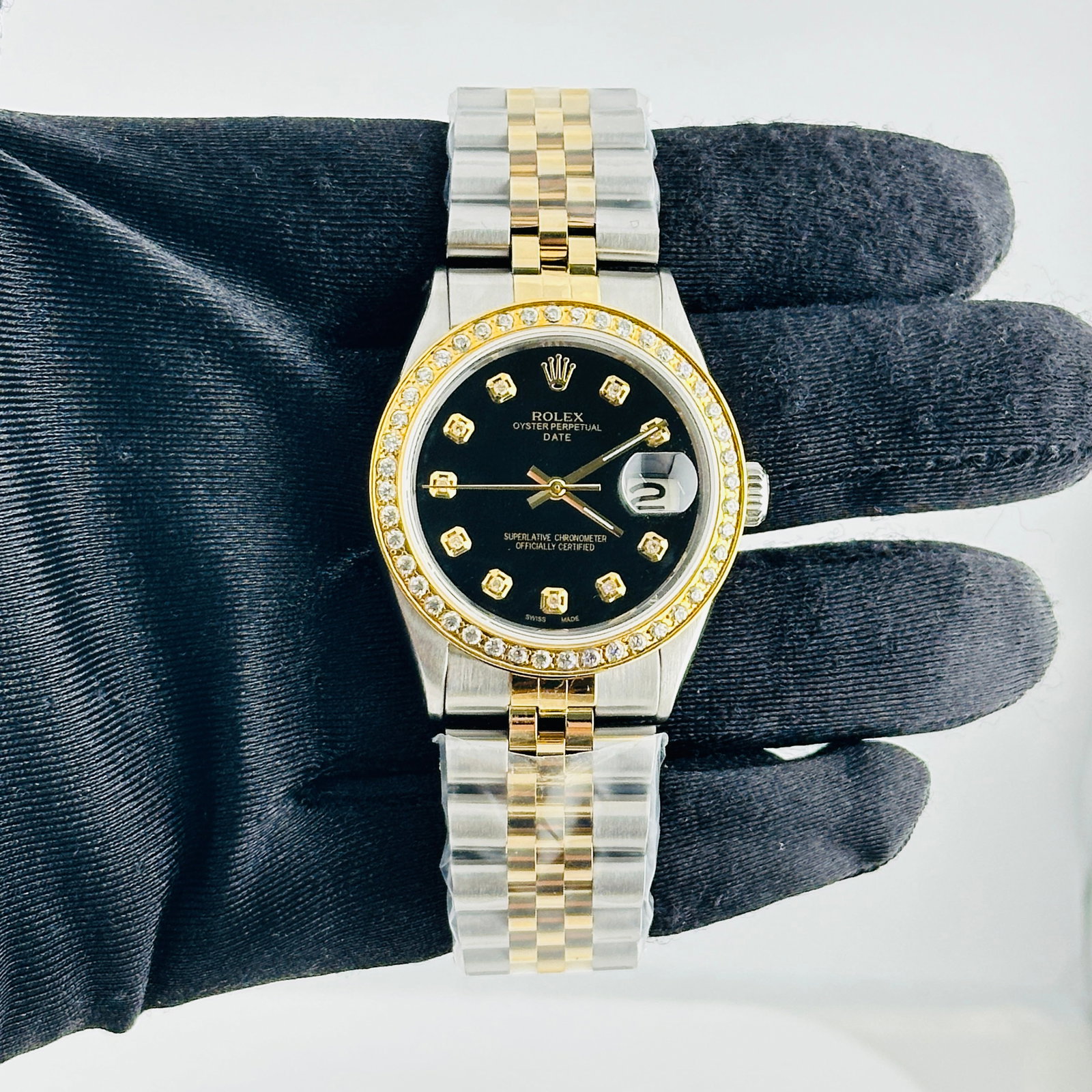 Rolex Datejust Ref. 1601 Mens Watch with aftermarket Jubilee bracelet: Rolex Datejust Ref. 1601 Mens Watch with aftermarket Jubilee bracelet Mens Rolex Datejust reference 1601 with an Aftermarket black diamond dial, pave yellow gold plated diamond bezel, and Aftermarket 