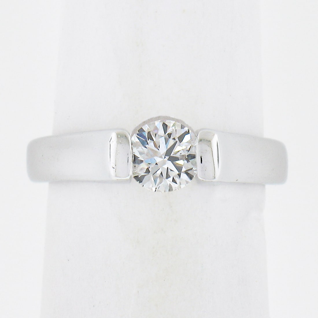 14K White Gold 0.45ct VS2 Channel Set Diamond Engagement Ring: 14K White Gold 0.45ct VS2 Channel Set Diamond Engagement Ring This exquisite engagement ring features a stunning 0.45ct round brilliant ideal cut diamond, securely channel set in solid 14K white gold.