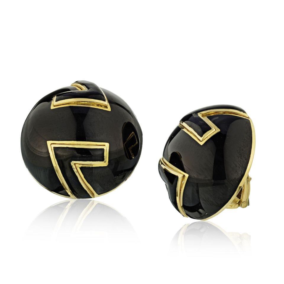 David Webb Platinum 18K Gold Black Enamel Clip-On Earrings: David Webb Platinum 18K Gold Black Enamel Clip-On Earrings These exquisite clip-on earrings by David Webb feature a striking design with a combination of platinum and 18K yellow gold. The earrings are