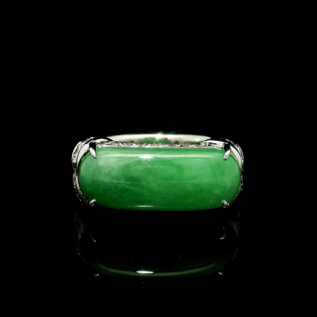 18k White Gold GIA Certified 7.14ct Burma Jade Diamond Saddle Band Ring: 18k White Gold GIA Certified 7.14ct Burma Jade Diamond Saddle Band Ring This exquisite saddle band ring showcases a stunning natural Burma jade cabochon, elegantly set in solid 18k white gold. The jad