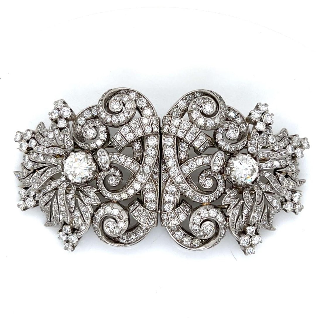 Art Deco Platinum Diamond Clip Brooches 2.70 Ct Diamonds: Art Deco Platinum Diamond Clip Brooches 2.70 Ct Diamonds This exquisite pair of Art Deco Platinum Diamond Double Clips showcases a stunning design, weighing a total of 69.3 grams. Each clip features t