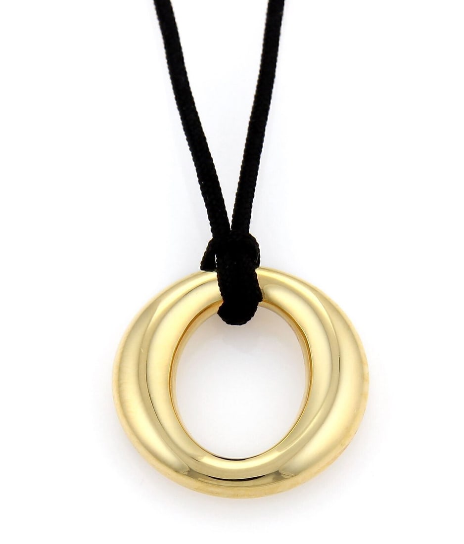 Tiffany & Co. Elsa Peretti Sevillana Pendant Necklace 18k Gold Black Cord: Tiffany & Co. Elsa Peretti Sevillana Pendant Necklace 18k Gold Black Cord Elsa Peretti Sevillana pendant necklace featuring an 18k yellow gold sculptural pendant suspended from a black cord. This pre-