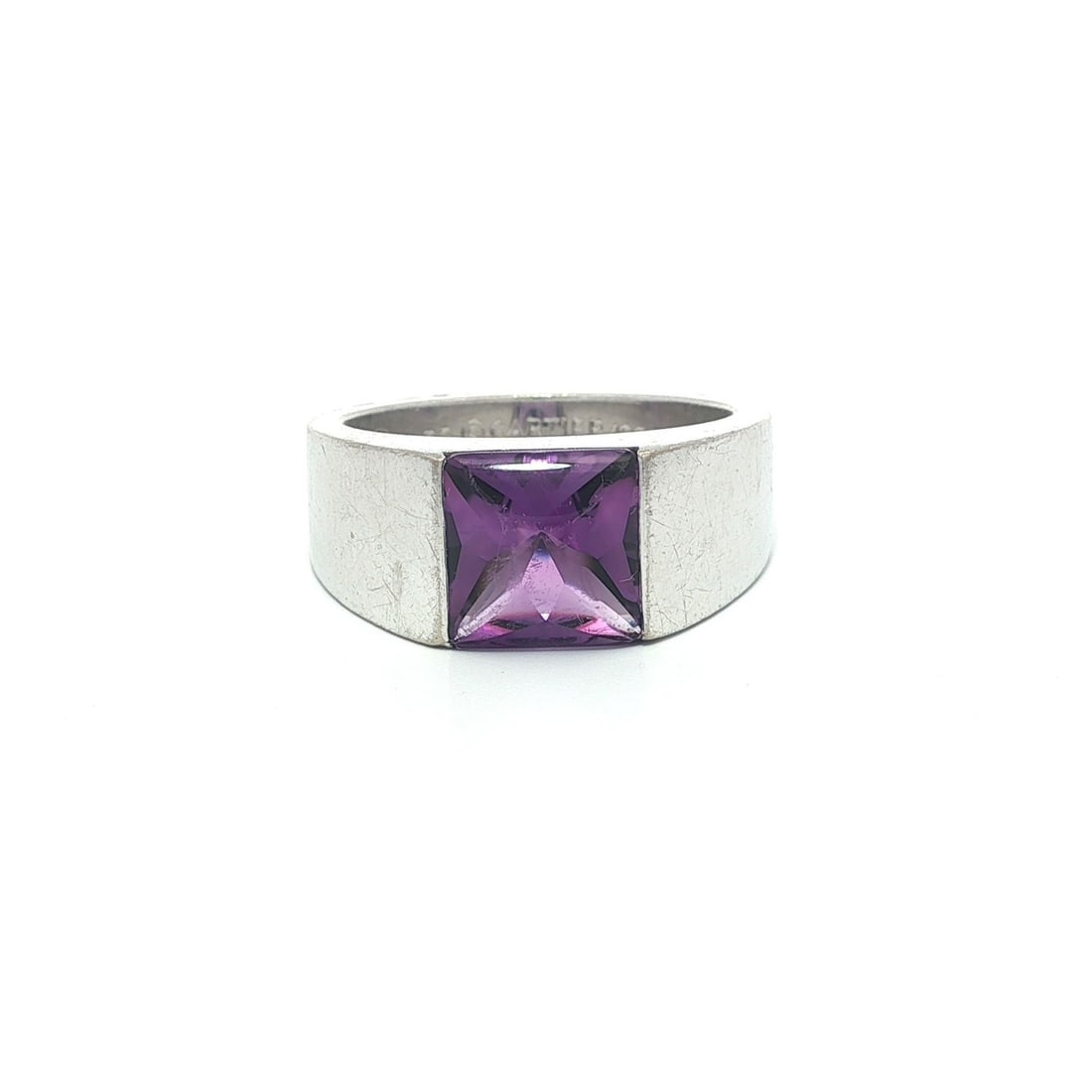 Cartier 1997 Amethyst Cabochon 18k White Gold Solitaire Ring Size 53: Cartier 1997 Amethyst Cabochon 18k White Gold Solitaire Ring Size 53 This Cartier ring from 1997 features a cabochon-cut natural amethyst solitaire, channel set in solid 18k white gold. The amethyst m