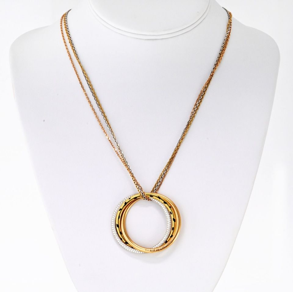 Cartier 18K Tri Color Trinity Diamond Necklace 1.00ct: Cartier 18K Tri Color Trinity Diamond Necklace 1.00ct This stunning Cartier necklace showcases the elegance of the Tri Color Trinity design, featuring interlocking rings in 18K tri-color gold. The nec