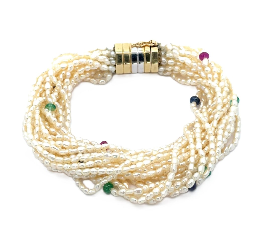 14k Two Tone Gold Multi Strand Pearl and Gemstone Bracelet: 14k Two Tone Gold Multi Strand Pearl and Gemstone Bracelet This exquisite multi-strand bracelet combines the elegance of genuine freshwater cultured pearls with vibrant gemstone accents. Featuring bar