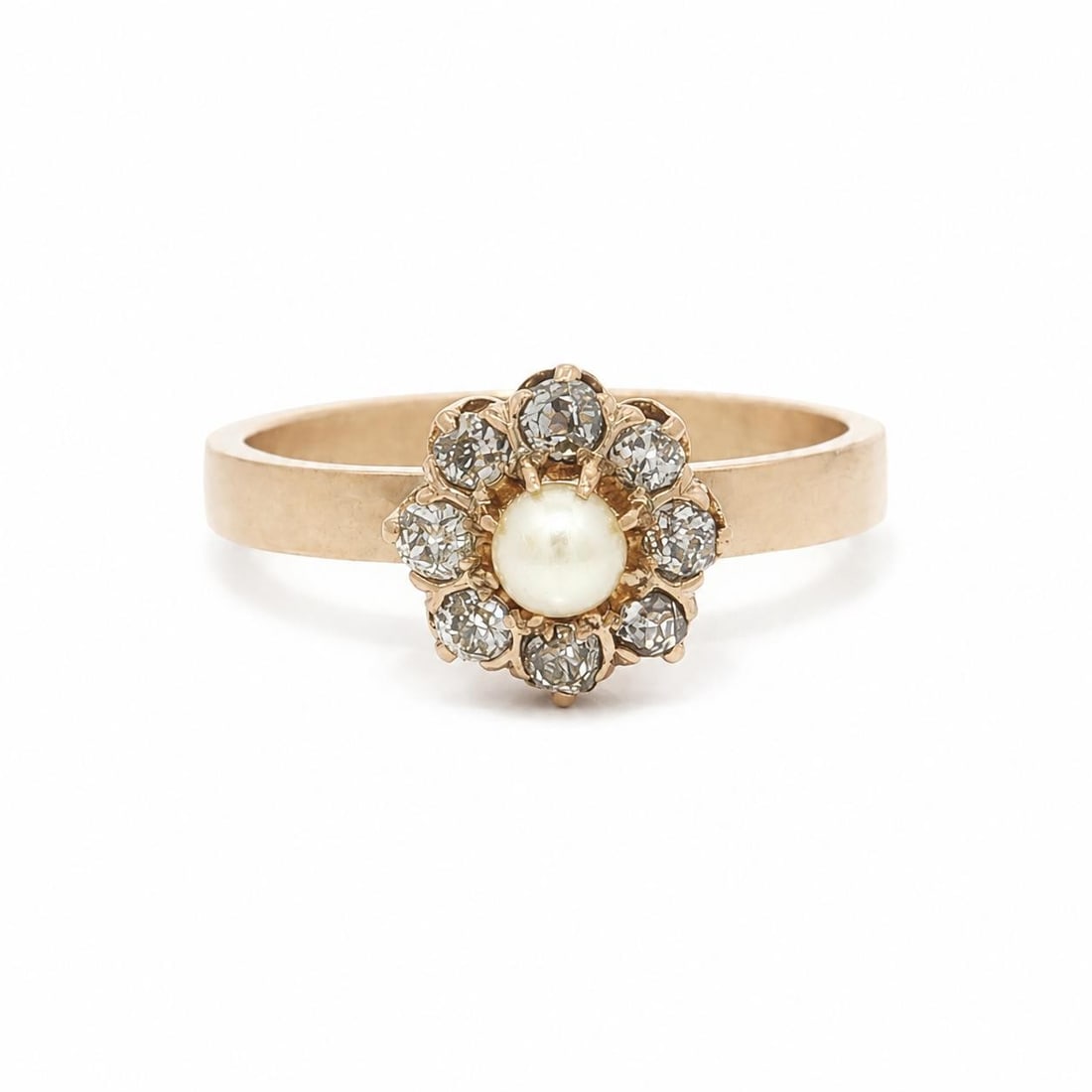 Victorian pearl and old mine diamond flower cluster ring in 14k gold: Victorian pearl and old mine diamond flower cluster ring in 14k gold Antique Victorian cluster flower ring crafted in solid 14k rosy yellow gold. The design features a round white cultured pearl at th