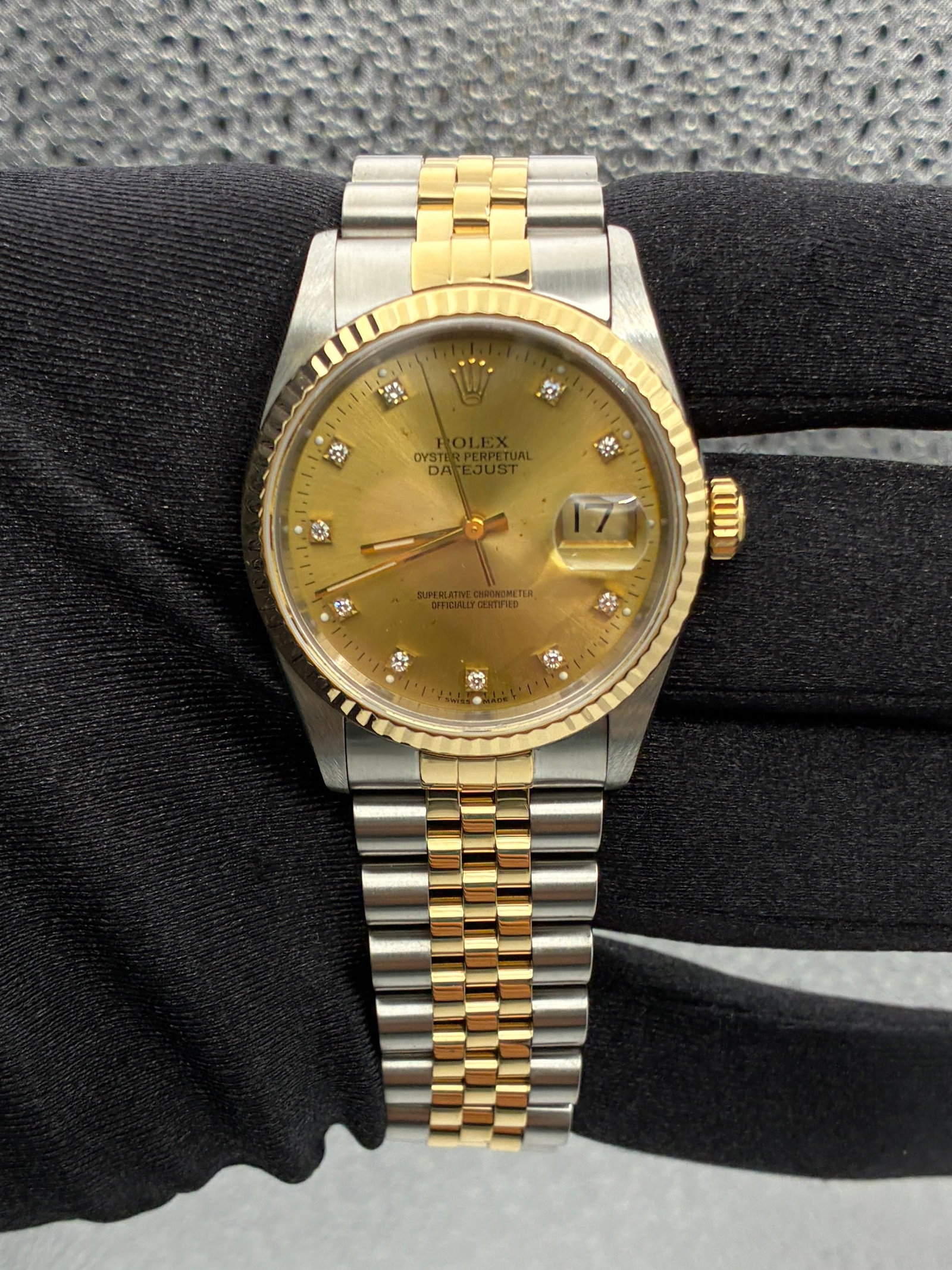 Rolex Datejust 16233G Champagne Diamond Dial Jubilee Bracelet: Rolex Datejust 16233G Champagne Diamond Dial Jubilee Bracelet This men's Rolex Datejust features a champagne diamond factory dial, complemented by a fluted bezel and a Jubilee bracelet. The watch is i