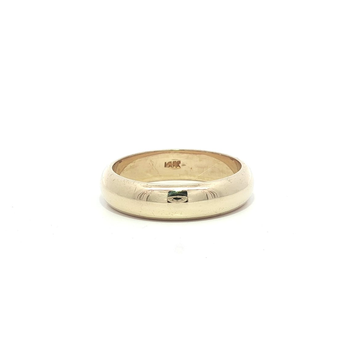 Classic 14k Yellow Gold 5mm Domed Stack Band Ring: Classic 14k Yellow Gold 5mm Domed Stack Band Ring This classic solid 14k yellow gold stack band ring features a polished dome design, making it a timeless addition to any jewelry collection. With a wi