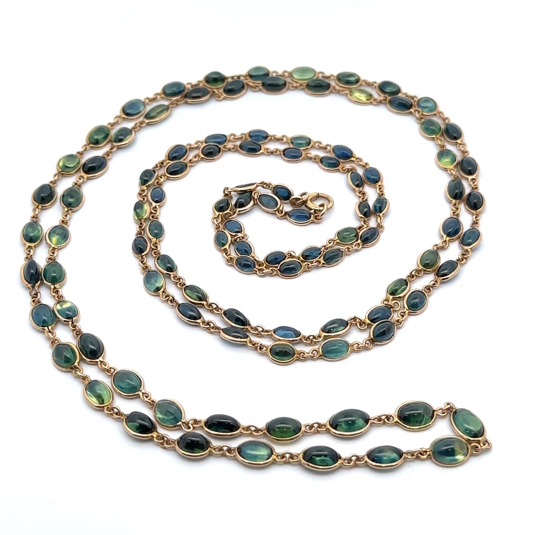 14k Yellow Gold GIA Certified 90ctw Unique Cabochon Sapphire 46" Necklace: 14k Yellow Gold GIA Certified 90ctw Unique Cabochon Sapphire 46" Necklace This exquisite 14k Yellow Gold wrap necklace features a stunning collection of 102 natural genuine sapphires, showcasing their