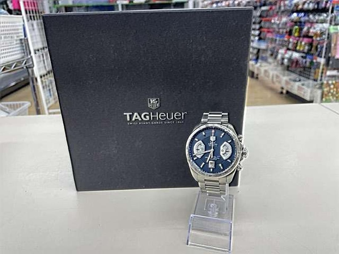 TAG Heuer CAV511F Grand Carrera Caliber 17 RS Chronograph Wristwatch: TAG Heuer CAV511F Grand Carrera Caliber 17 RS Chronograph Wristwatch Pre-owned TAG Heuer Grand Carrera men's wristwatch with a Chronograph Caliber 17RS. It features an automatic movement, 10 ATM water