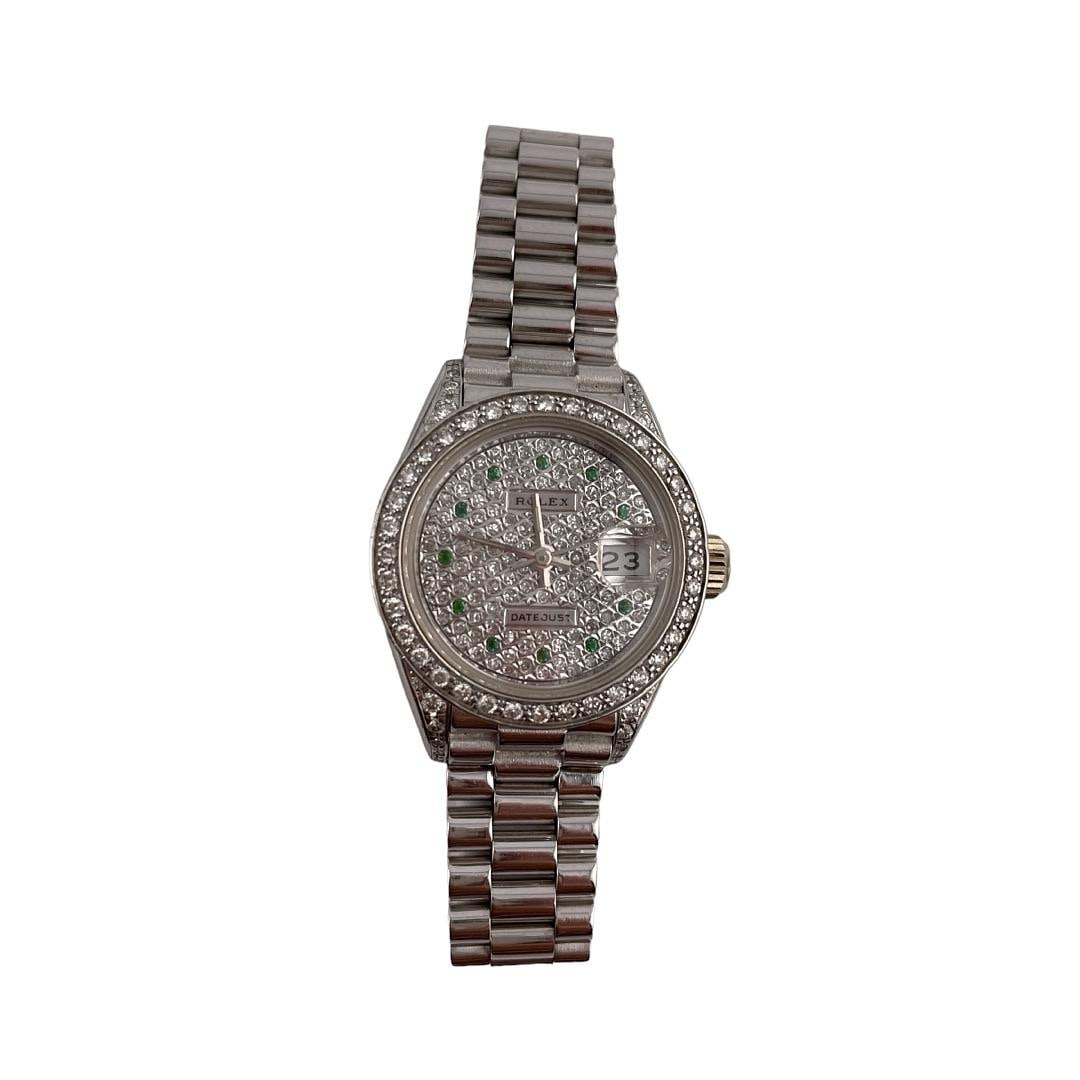 Ladies Rolex Datejust 69179 Diamond Dial Aftermarket President Bracelet: Ladies Rolex Datejust 69179 Diamond Dial Aftermarket President Bracelet This ladies Rolex Datejust features a diamond dial and diamond bezel, complemented by an aftermarket President bracelet. The wat