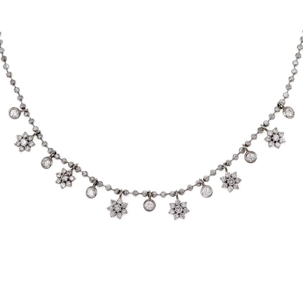 Elegant 1.00ct Diamond 14k White Gold Floral Charm Necklace: Elegant 1.00ct Diamond 14k White Gold Floral Charm Necklace This exquisite necklace is designed with 14k white gold and features a stunning arrangement of 13 alternating dangle charms, each showcasing