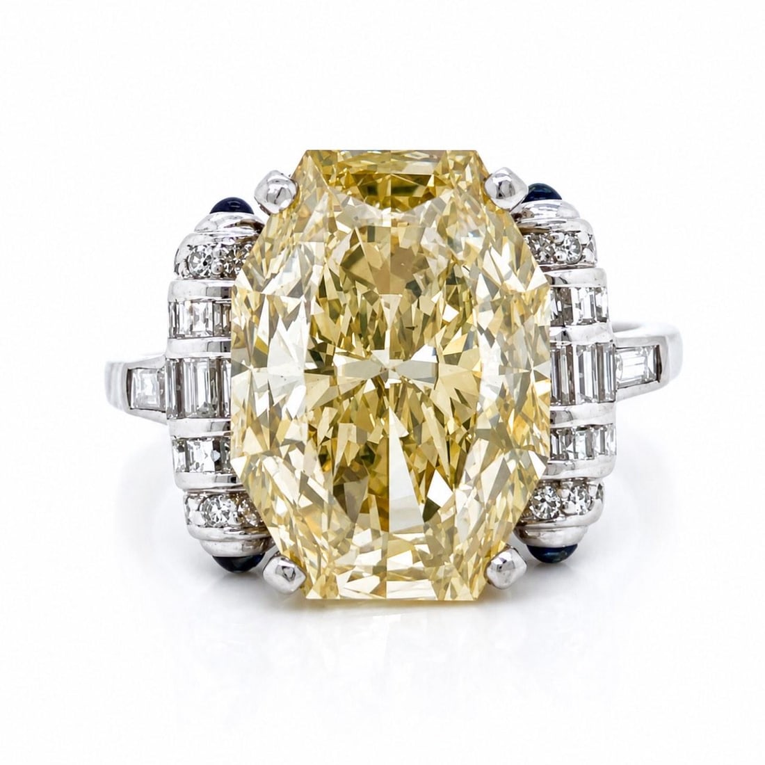 GIA Certified 7.65 Ct Fancy Yellow Diamond Platinum Art Deco Ring: GIA Certified 7.65 Ct Fancy Yellow Diamond Platinum Art Deco Ring Art Deco platinum ring centered with a GIA certified 7.65 ct octagonal brilliant diamond in fancy brownish yellow color with SI2 clari