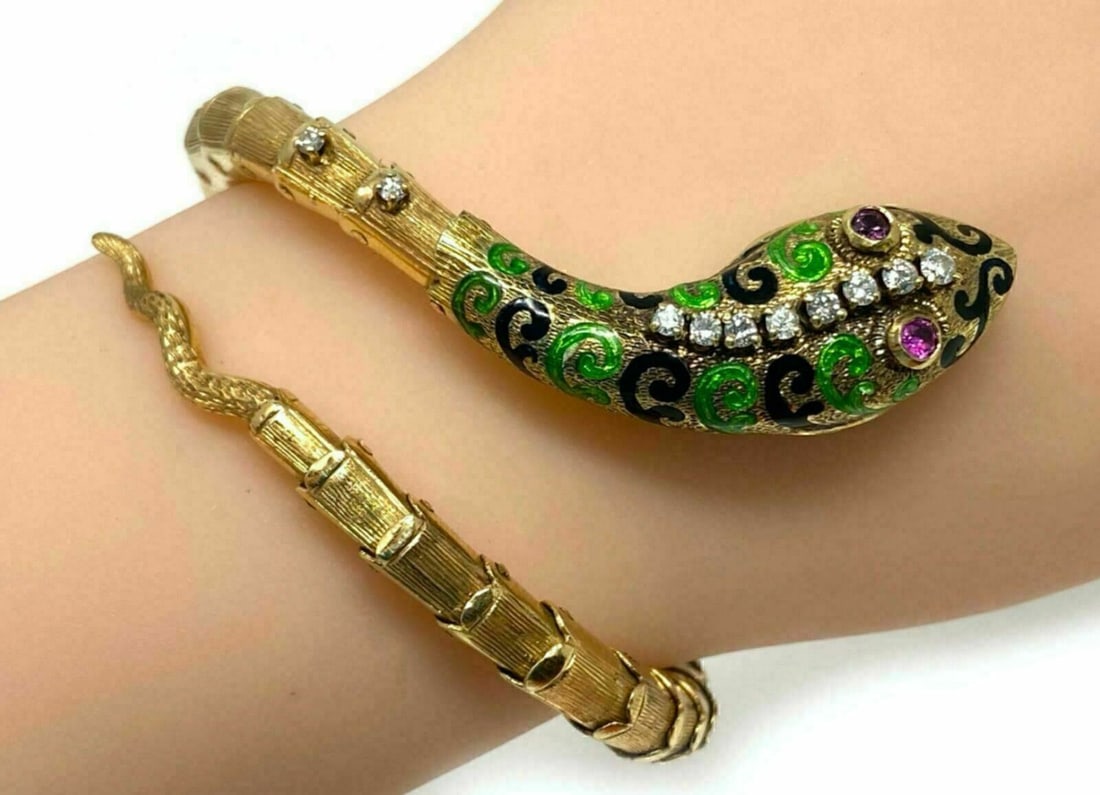 14k Yellow Gold Snake Wrap Bracelet with Ruby Diamond Enamel: 14k Yellow Gold Snake Wrap Bracelet with Ruby Diamond Enamel Vintage estate snake wrap bracelet crafted in 14k yellow gold with a flexible coiled design. The sculpted serpent motif is accented with na