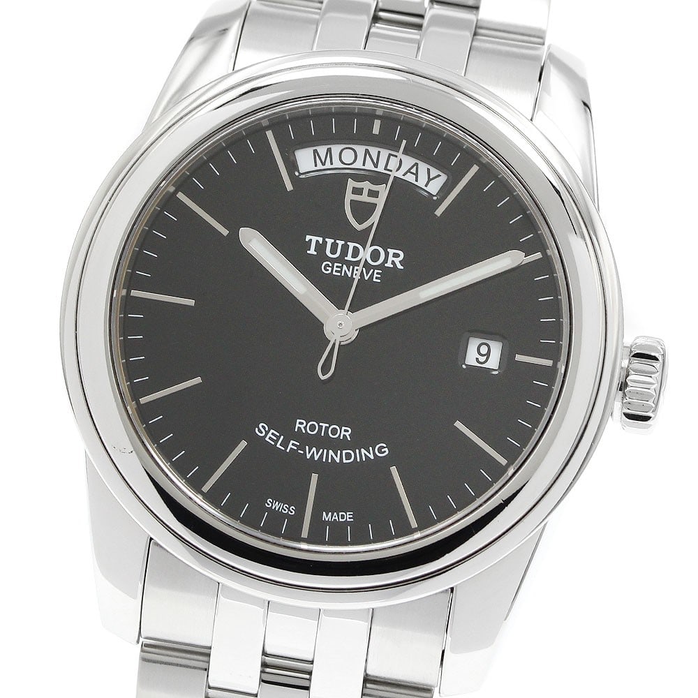 TUDOR Glamour Date-Day Ref 56000 Automatic Stainless Steel Wristwatch: TUDOR Glamour Date-Day Ref 56000 Automatic Stainless Steel Wristwatch Pre-owned TUDOR Glamour Date-Day automatic men's wristwatch with a black dial and stainless steel case and bracelet. This referenc