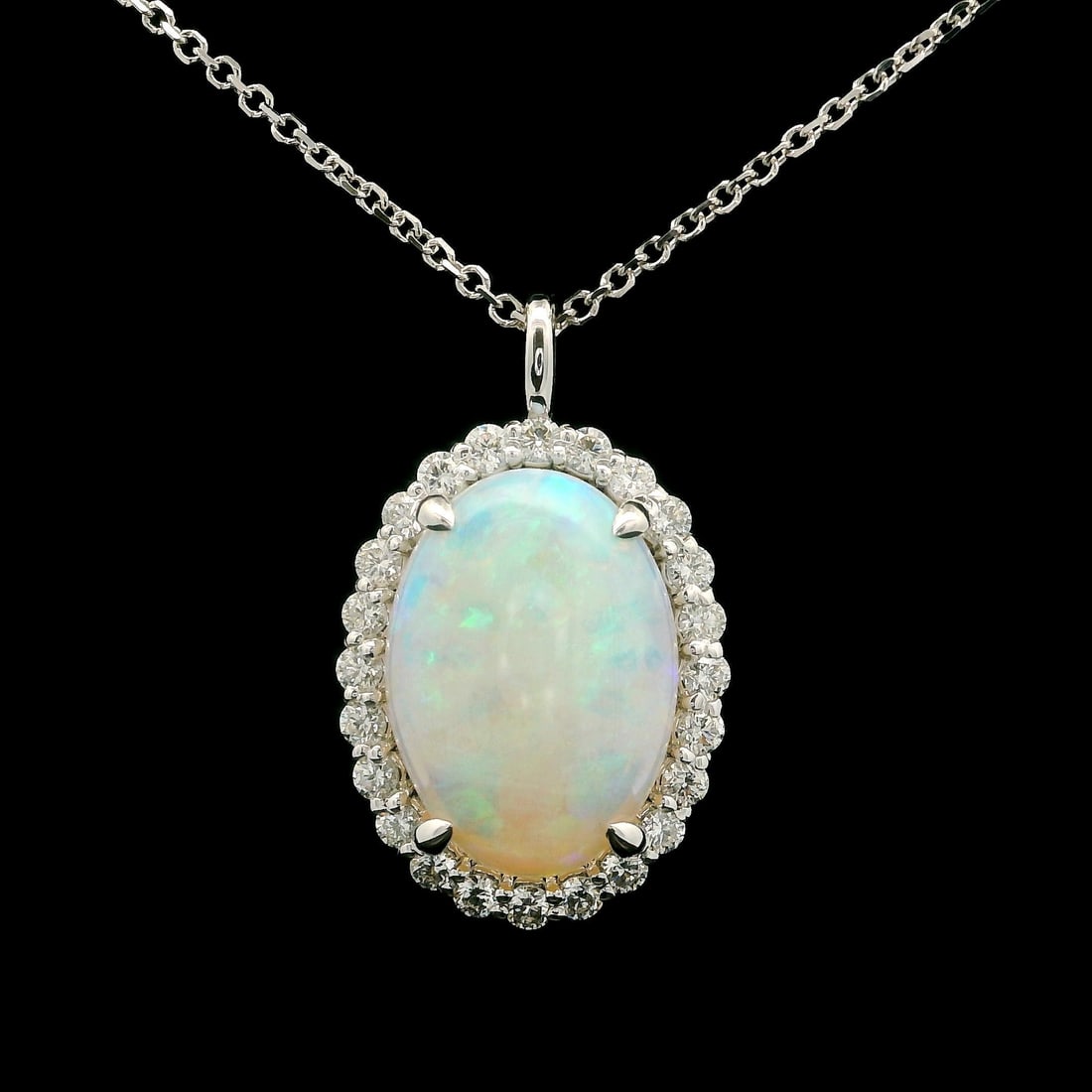 14k White Gold 4.43ct Opal Halo Diamond Pendant Necklace 18 Inch: 14k White Gold 4.43ct Opal Halo Diamond Pendant Necklace 18 Inch This exquisite pendant necklace features a stunning oval opal set in solid 14k white gold, accompanied by a halo of sparkling diamonds.