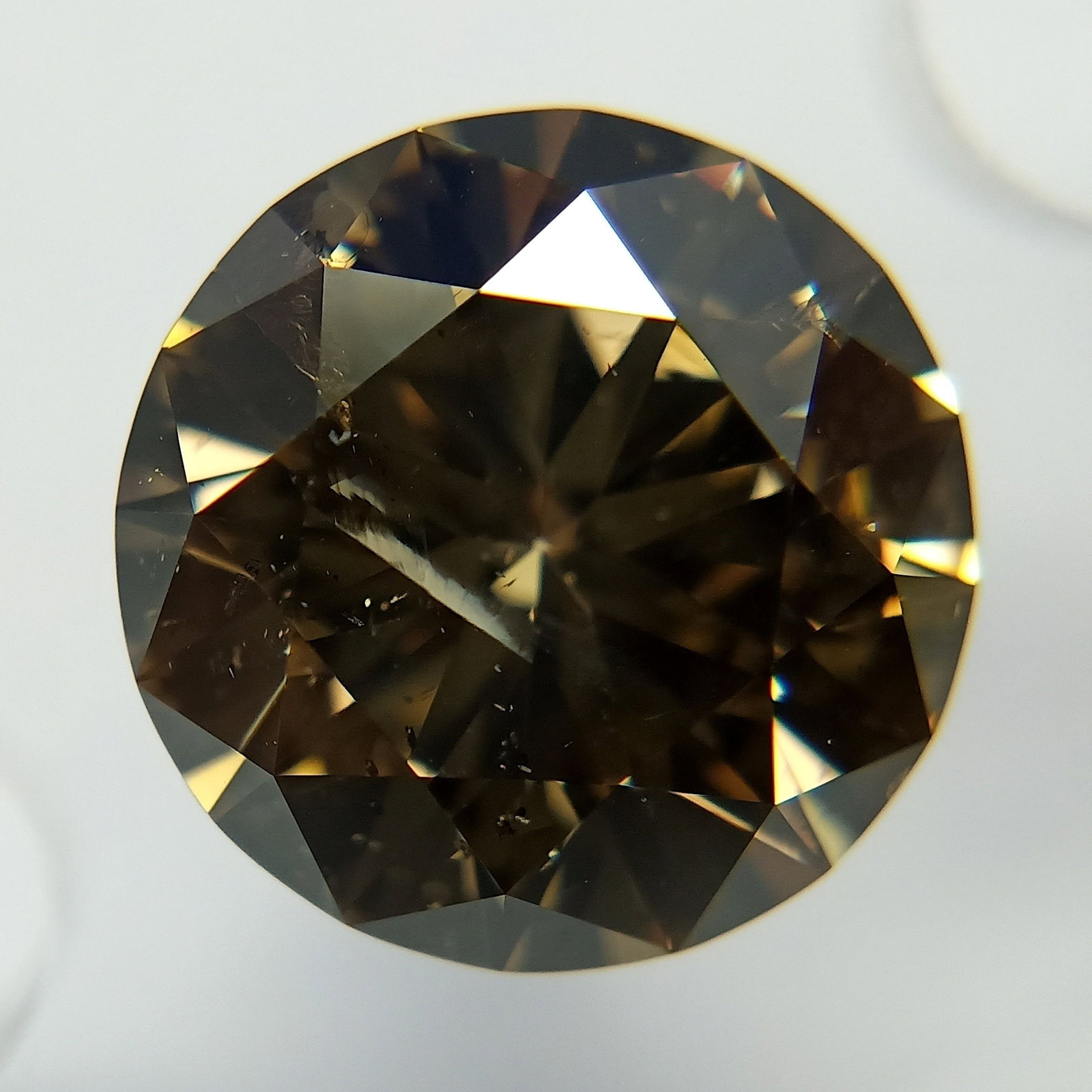 Loose Diamond - ROUND 4.0ct Fancy Dark Yellowish Brown: Loose Diamond - ROUND 4.0ct Fancy Dark Yellowish Brown Source: Natural Shape: ROUND Carats: 4.0 Color: Fancy Dark Yellowish Brown Certification: GIA PLEASE NOTE: Framed, Large, or heavy items do not h