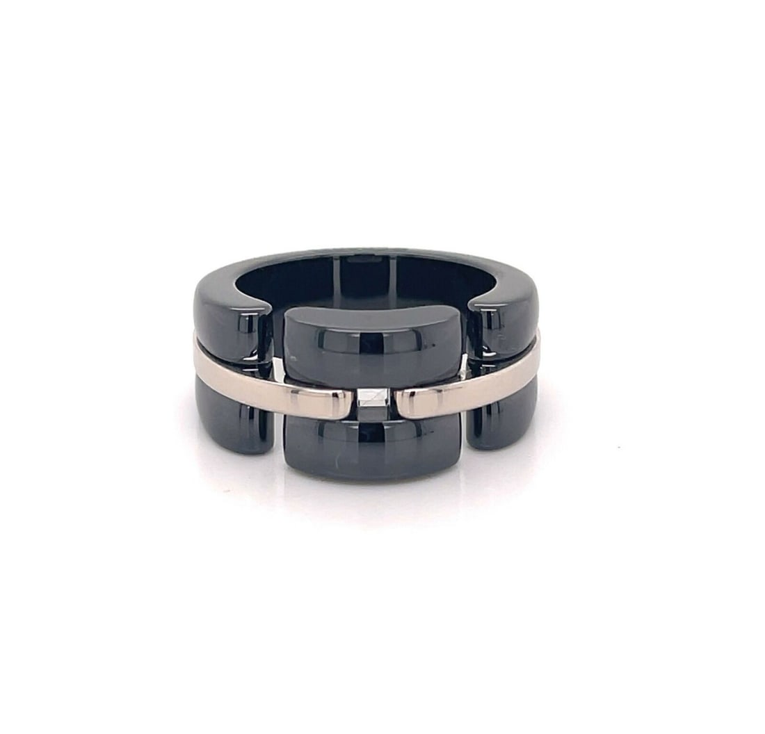 Chanel Ultra wide band ring in 18k white gold black ceramic size 5.75: Chanel Ultra wide band ring in 18k white gold black ceramic size 5.75 Authentic Chanel Ultra band ring crafted in 18k white gold with a black ceramic center. This wide band design features clean, arch