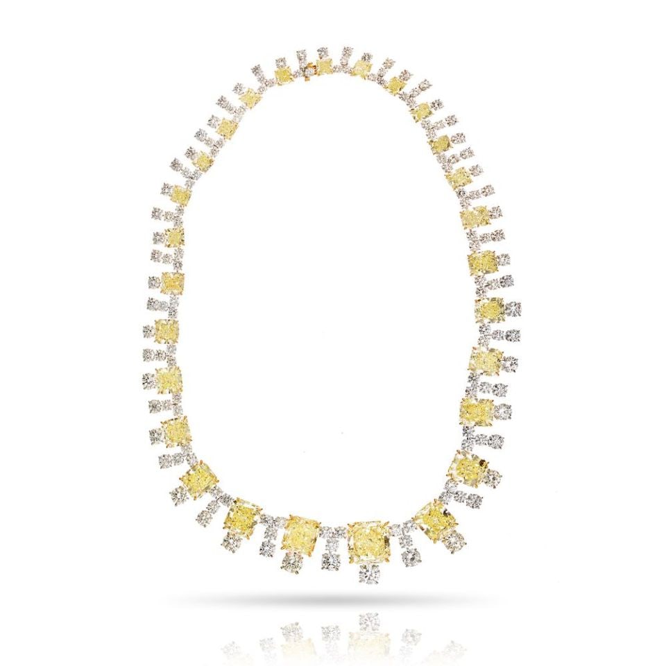 GIA Certified Fancy Yellow Diamond Necklace Platinum 18K Gold 94.65 Cts: GIA Certified Fancy Yellow Diamond Necklace Platinum 18K Gold 94.65 Cts This luxurious necklace showcases a breathtaking combination of platinum and 18K yellow gold, weighing 90.7 grams. The design fe