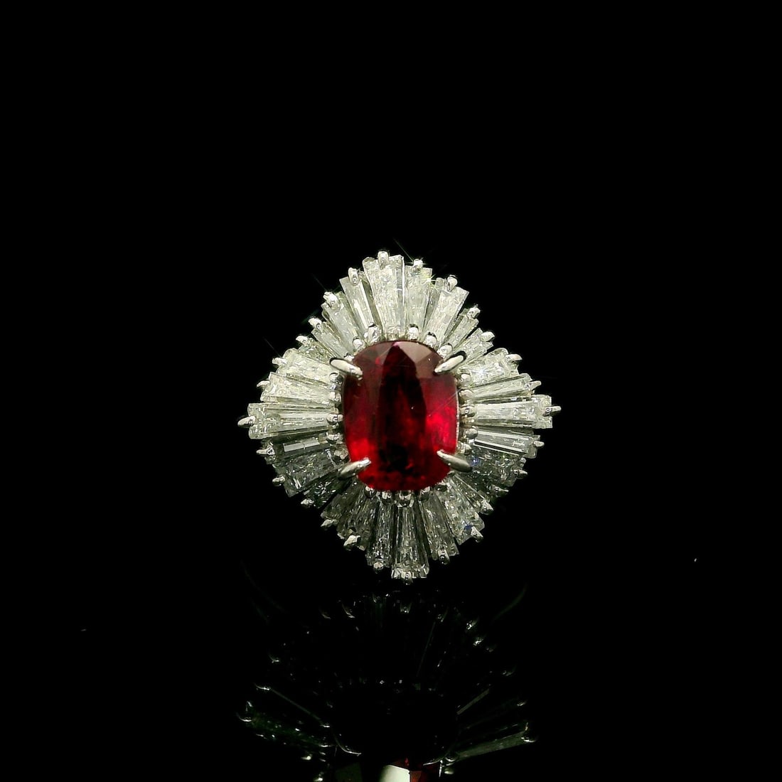 Platinum Ruby and Baguette Diamond Ballerina Ring GIA Certified Cushion Cut: Platinum Ruby and Baguette Diamond Ballerina Ring GIA Certified Cushion Cut This vintage platinum ballerina-style cocktail ring features a GIA-certified 1.63 carat cushion-cut natural ruby as its cent