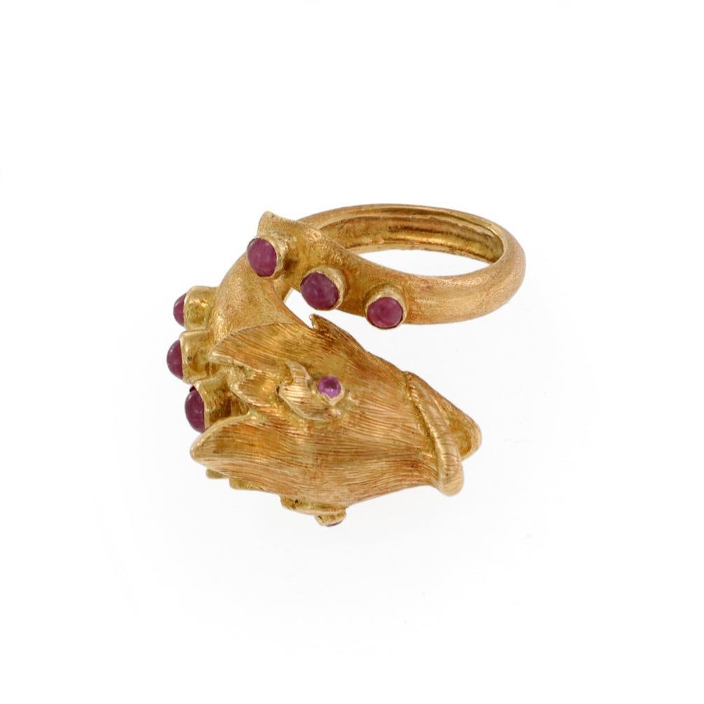 Vintage 18k Yellow Gold Fish Ruby Bypass Ring: Vintage 18k Yellow Gold Fish Ruby Bypass Ring This captivating vintage ring showcases a unique fish design, meticulously crafted from 18k yellow gold with a lustrous textured finish. The ring features