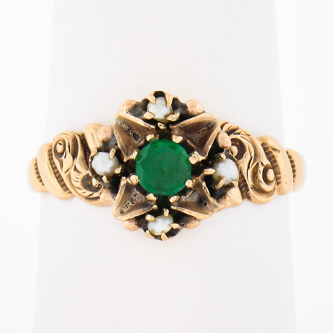 Victorian 10k Yellow Gold Ring with Emerald Seed Pearls Scrollwork: Victorian 10k Yellow Gold Ring with Emerald Seed Pearls Scrollwork Antique Victorian ring in solid 10k rosy yellow gold, featuring a natural round emerald with four genuine cultured seed pearls. The d