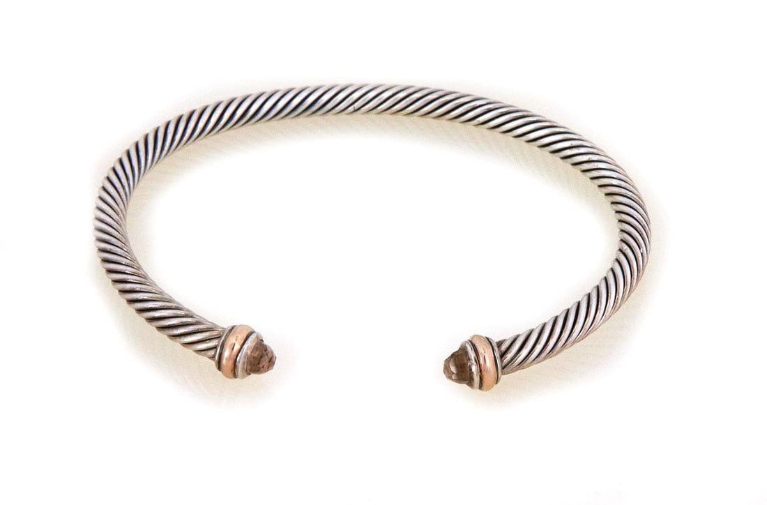 David Yurman 18k Gold Sterling Silver Cable Cuff Bracelet with Orange Gemstones: David Yurman 18k Gold Sterling Silver Cable Cuff Bracelet with Orange Gemstones This exquisite David Yurman bracelet is a stunning piece from the Cable Cuff Collection, crafted in a small size. The br