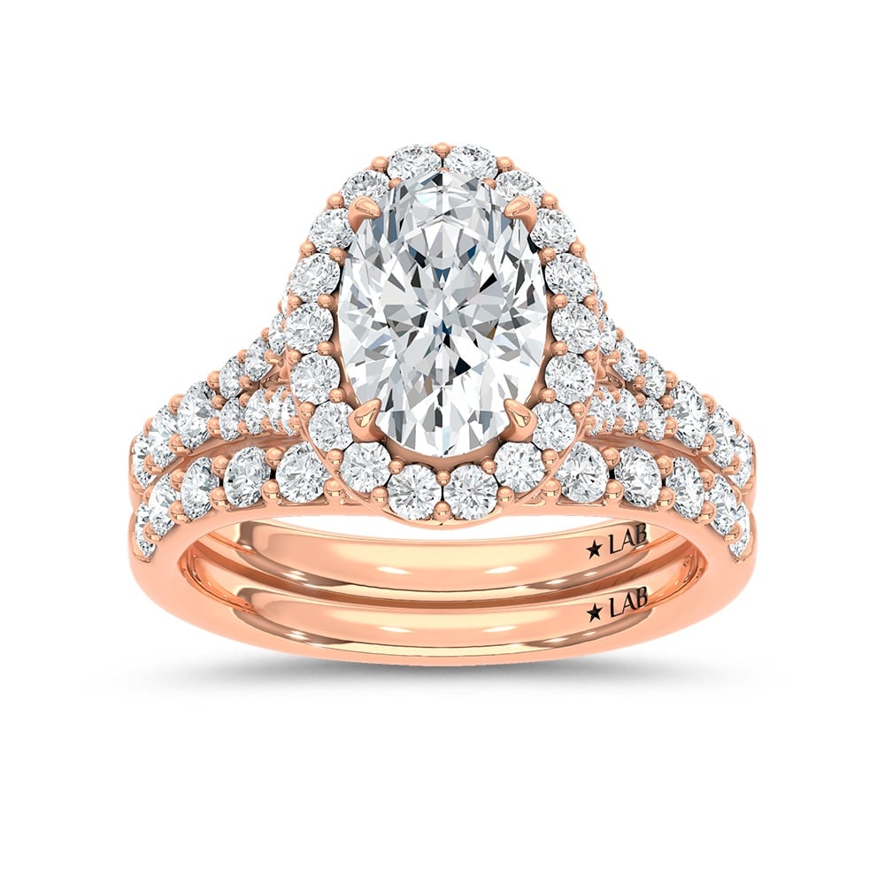 14K Rose Gold 3 Ct.Tw. Lab Grown Diamond Oval Shape Bridal Ring (IGI Certified Center 2ct Oval): 14K Rose Gold 3 Ct.Tw. Lab Grown Diamond Oval Shape Bridal Ring (IGI Certified Center 2ct Oval) 14k Rose Gold Stone Color: D-f Stone Clarity: Vs Each ring is presented in standard size 6.5. Compliment