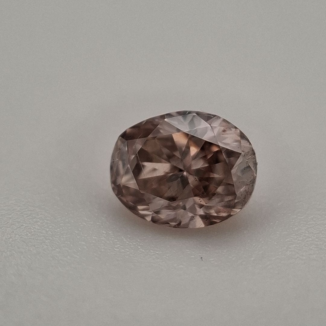 Loose Diamond - OVAL 0.45ct Fancy Pinkish Brown I1: Loose Diamond - OVAL 0.45ct Fancy Pinkish Brown I1 Source: Natural Shape: OVAL Carats: 0.45 Color: Fancy Pinkish Brown Certification: EGL PLEASE NOTE: Framed, Large, or heavy items do not have shippin