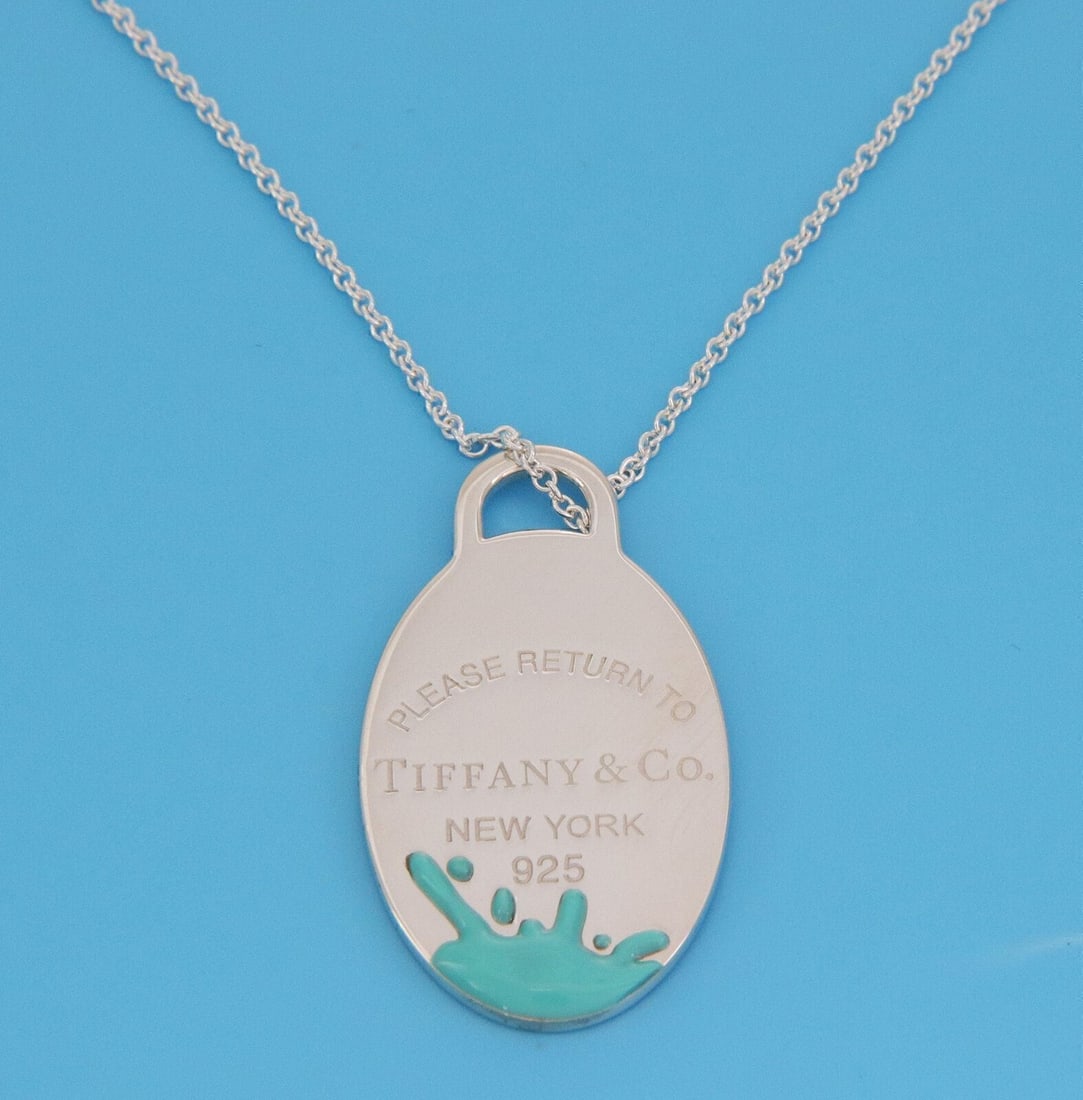 Tiffany & Co. Return to Tiffany Splash Sterling Silver Enamel Oval Pendant Necklace: Tiffany & Co. Return to Tiffany Splash Sterling Silver Enamel Oval Pendant Necklace Pre-owned Tiffany & Co. Return to Tiffany Splash oval pendant necklace in sterling silver with enamel. This necklace