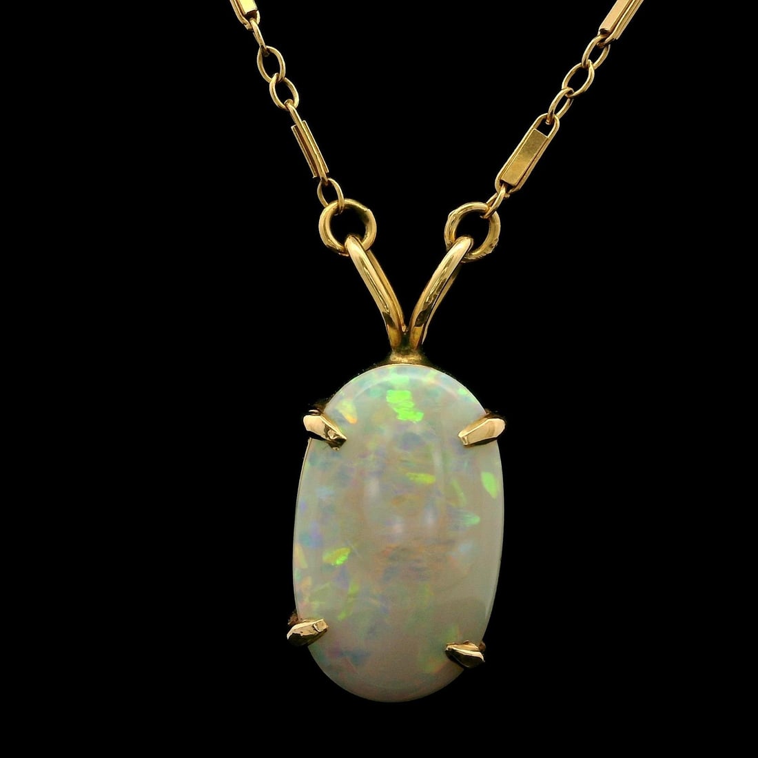 Antique 12k-14k Yellow Gold Chain with Grey Opal Slide Pendant: Antique 12k-14k Yellow Gold Chain with Grey Opal Slide Pendant This exquisite antique necklace features a solid yellow gold fancy link chain adorned with a stunning oval grey opal slide pendant. The p