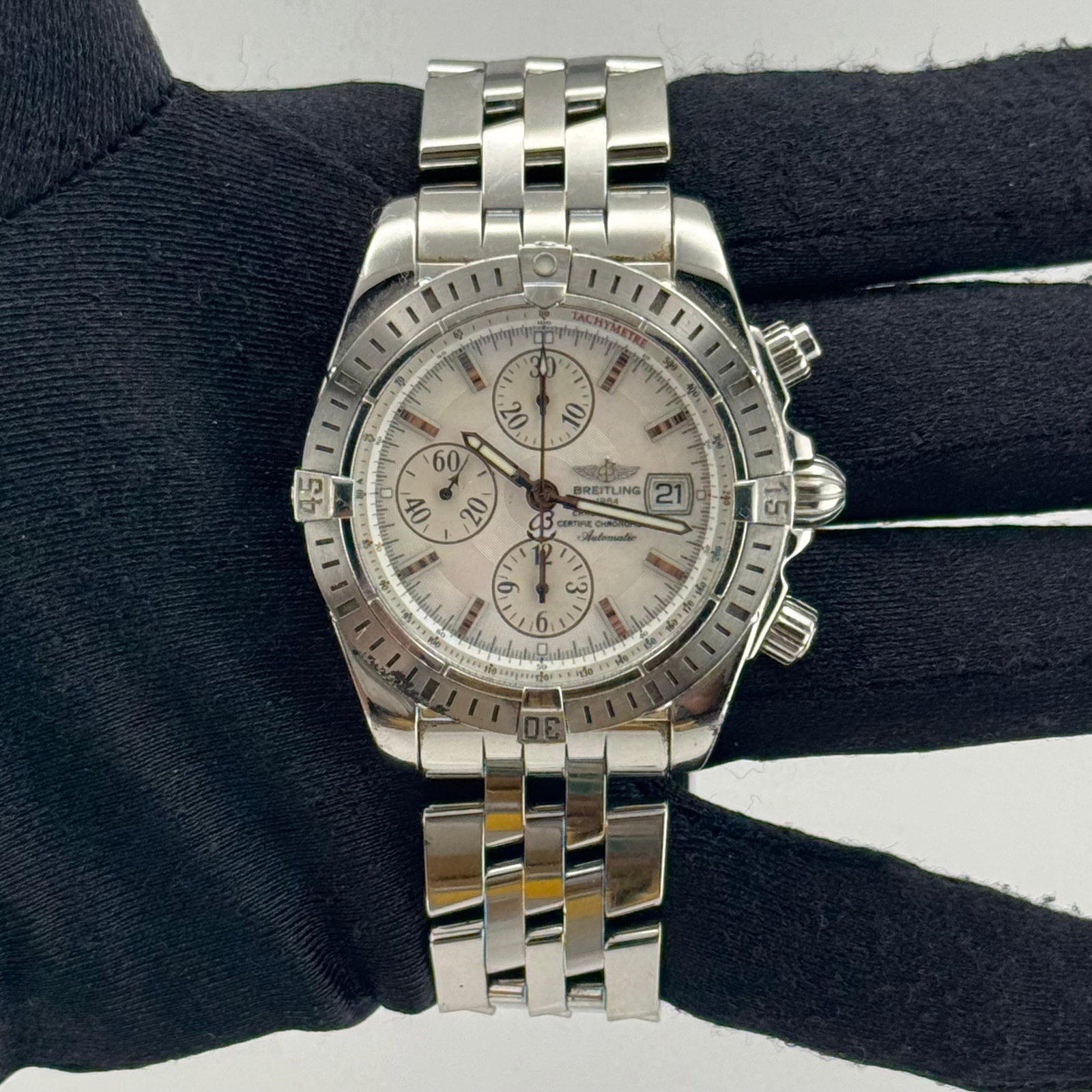 Breitling A13356 Chronomat Evolution Mens Watch White M.O.P. Dial Manuals: Breitling A13356 Chronomat Evolution Mens Watch White M.O.P. Dial Manuals Breitling Chronomat Evolution men's watch featuring a white M.O.P. dial, rotating steel bezel, and stainless steel bracelet. T
