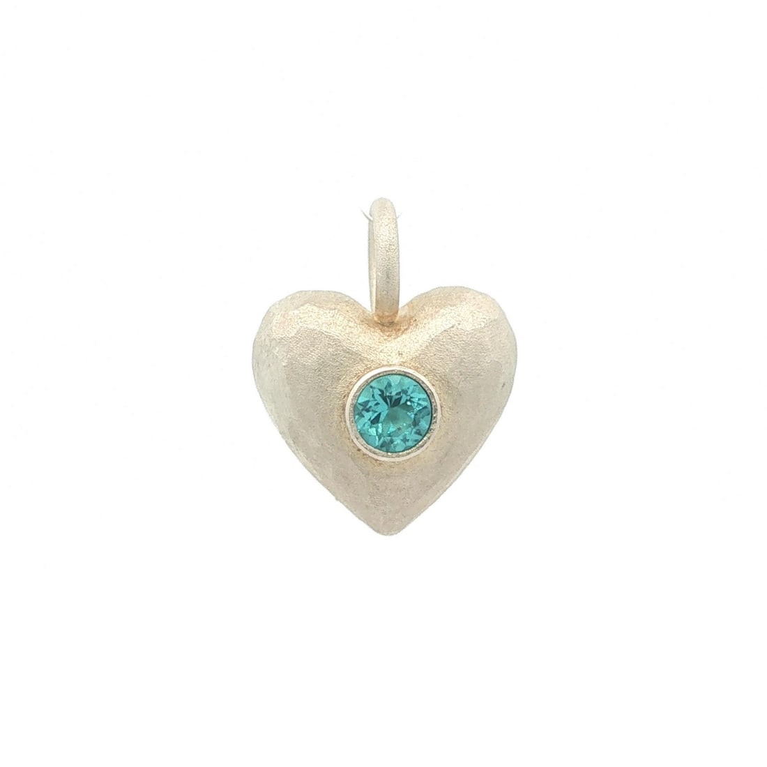Sterling Silver Heart Pendant with Swiss Blue Topaz Handmade Matte Finish: Sterling Silver Heart Pendant with Swiss Blue Topaz Handmade Matte Finish Handmade heart pendant in solid sterling silver with a matte hammered finish, set with one natural Swiss blue topaz in a bezel