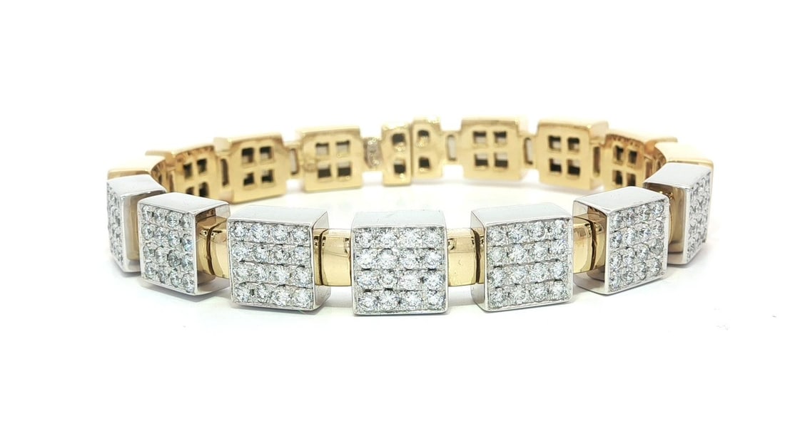 Two Tone 18k Gold 1.68ctw Diamond Cuff Bracelet: Two Tone 18k Gold 1.68ctw Diamond Cuff Bracelet This exquisite cuff bracelet features a striking two-tone design crafted in solid 18k yellow gold and 16k white gold. It showcases a total of 112 natura
